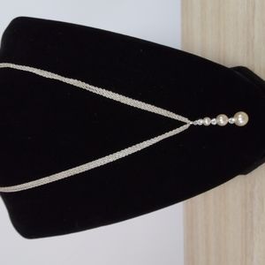 Silvertone triple chain with lovely 3 faux pearls and 3 rhinestones ppendant